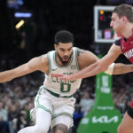 Jayson Tatum triple-double, 3s lead Celtics past Butler-less Heat 114-94 in playoff opener