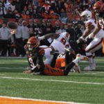 Joe Burrow throws remarkable TD pass to Tee Higgins while falling horizontal to his knees