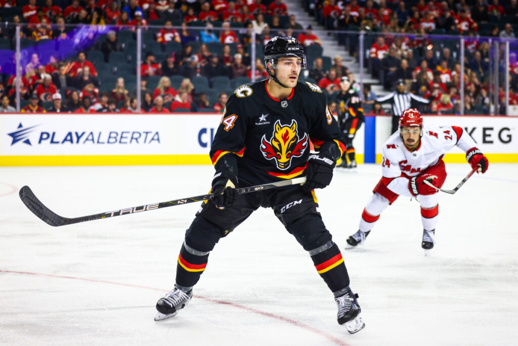 Flames Defenseman Crushes Sharks Forward With Big Open Ice Hit