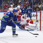 Alex DeBrincat scores in OT as Red Wings edge Canucks 3-2