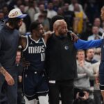 Mavericks star Kyrie Irving helped off the floor after awkward knee injury early in loss to Kings