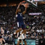 Reed scores 24 off the bench, UConn knocks off Providence 75-63