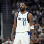 Mavericks star Kyrie Irving helped off the floor after awkward knee injury early in matchup with Kings