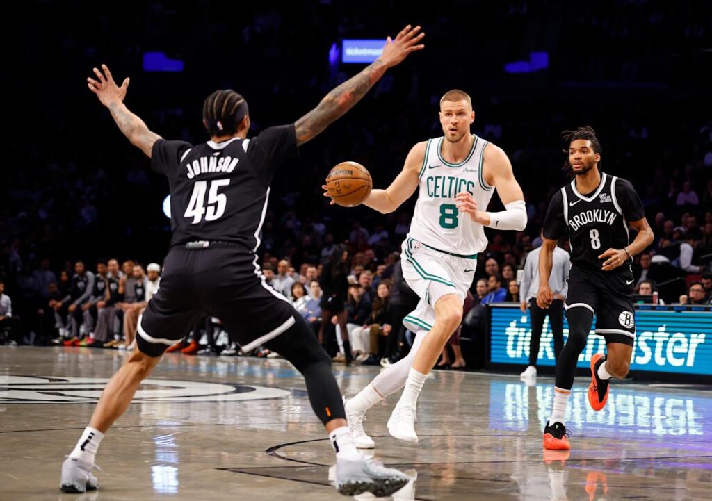 Porzingis scores 24 in his return to help the Celtics hold on to beat the Nets 115-113