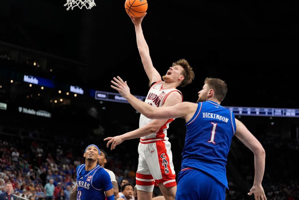 Arizona pulls away late to beat Kansas 88-77 in a Big 12 Conference Tournament quarterfinal