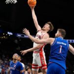 Arizona pulls away late to beat Kansas 88-77 in a Big 12 Conference Tournament quarterfinal