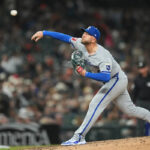 Royals pitcher Lucas Erceg helped off field after hard grounder hits left foot