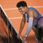 Shelton falls onto his stomach and still wins the point at the French Open