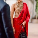 Sobhita Dhulipala styles Christian Dior bag worth Rs 3.37 Lakh with red satin saree at Akhil Akkineni-Zainab’s wedding reception