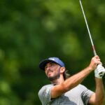 Max Homa carrying own golf bag